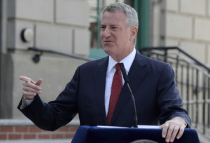 New York City Mayor Bill de Blasio says the city will reopen 100% on July 1